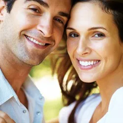 An image of a couple smiling